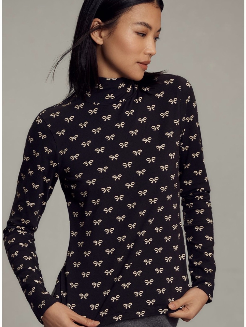 Maeve Black Turtleneck Top with Cream Bow Motif